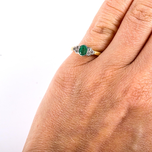 764 - A modern 18ct gold emerald and diamond cluster dress ring, bezel set with oval mixed-cut emerald and... 