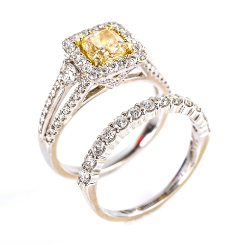 765 - A modern 18ct white gold fancy yellow diamond and diamond square halo cluster ring, set with 0.75ct ... 