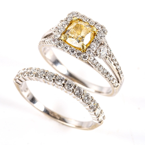 765 - A modern 18ct white gold fancy yellow diamond and diamond square halo cluster ring, set with 0.75ct ... 