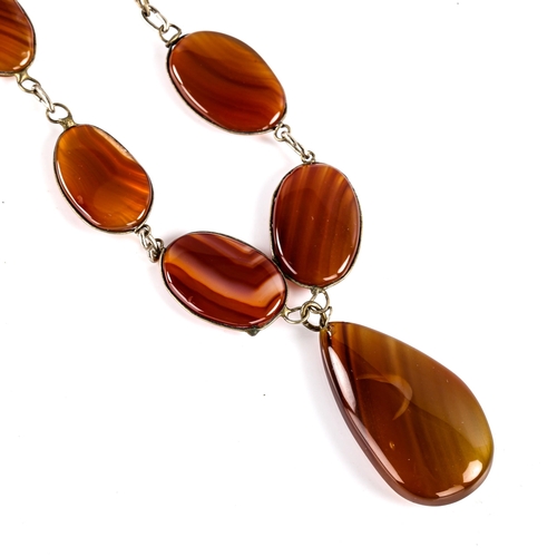 768 - A large polished carnelian tablet pendant necklace, necklace length 66cm, 82.5g