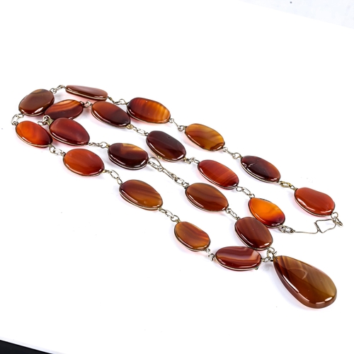 768 - A large polished carnelian tablet pendant necklace, necklace length 66cm, 82.5g