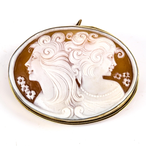 771 - A Vintage German carved shell cameo brooch, depicting 2 female profiles, in German silver-gilt frame... 