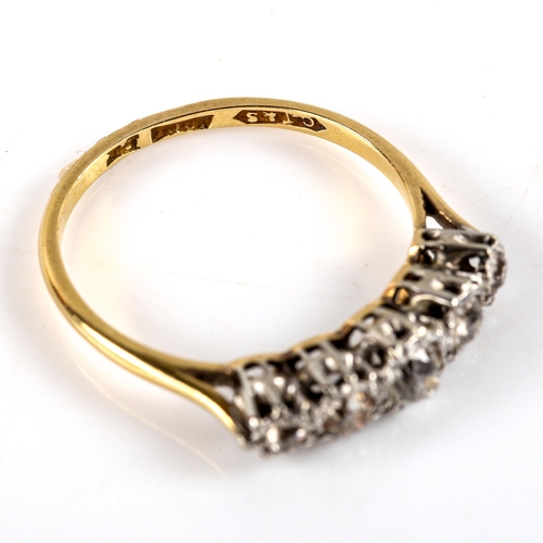 782 - An early 20th century 18ct gold graduated 5-stone diamond half hoop ring, illusion set with old-cut ... 