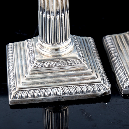 791 - ASPREY - a pair of George V silver squat Corinthian column table candlesticks, with removable sconce... 