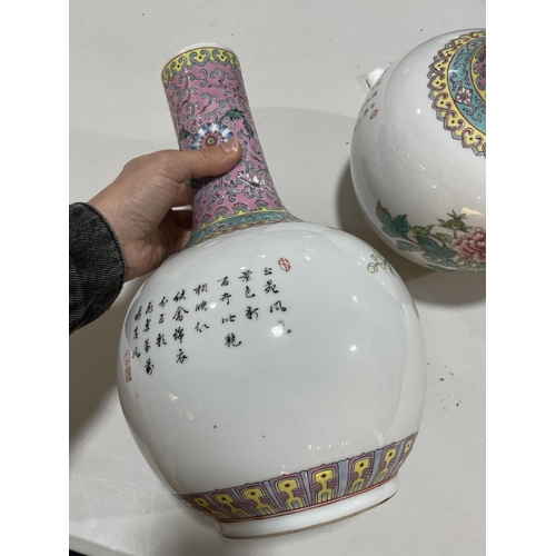 106 - A pair of Chinese porcelain narrow-neck bottle vases, decorated with peacocks and prunus and panels ... 