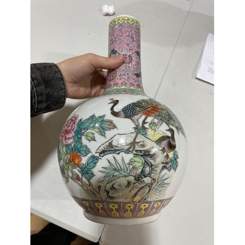 106 - A pair of Chinese porcelain narrow-neck bottle vases, decorated with peacocks and prunus and panels ... 