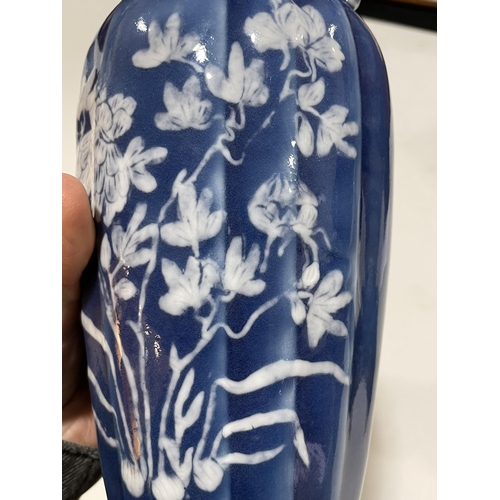 223 - A pair of Chinese blue glaze porcelain vases, with floral decoration, height 24cm