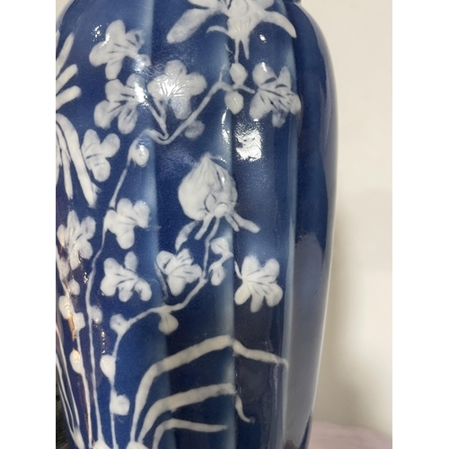 223 - A pair of Chinese blue glaze porcelain vases, with floral decoration, height 24cm