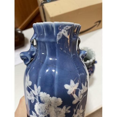 223 - A pair of Chinese blue glaze porcelain vases, with floral decoration, height 24cm