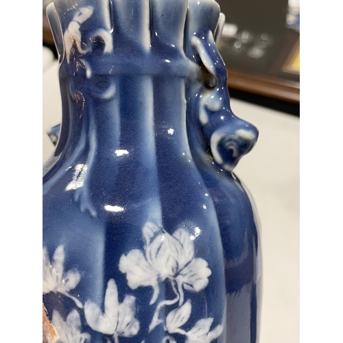 223 - A pair of Chinese blue glaze porcelain vases, with floral decoration, height 24cm