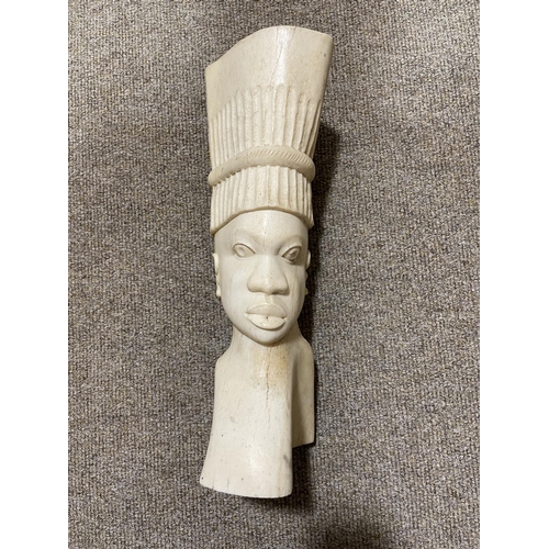 205 - An African head of a man carved from an elephants thigh bone, circa 1930/40, height 34cm