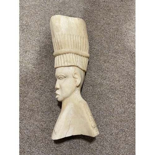 205 - An African head of a man carved from an elephants thigh bone, circa 1930/40, height 34cm