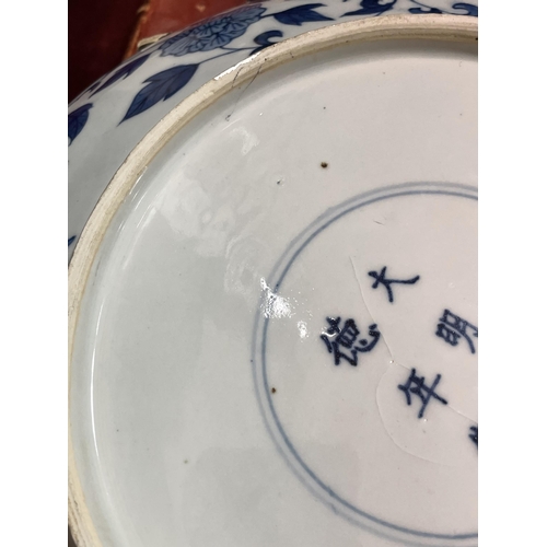 216 - A Chinese blue and white porcelain dragon bowl, 6 character mark, diameter 27cm