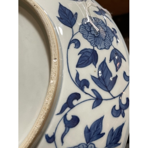 216 - A Chinese blue and white porcelain dragon bowl, 6 character mark, diameter 27cm