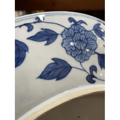 216 - A Chinese blue and white porcelain dragon bowl, 6 character mark, diameter 27cm