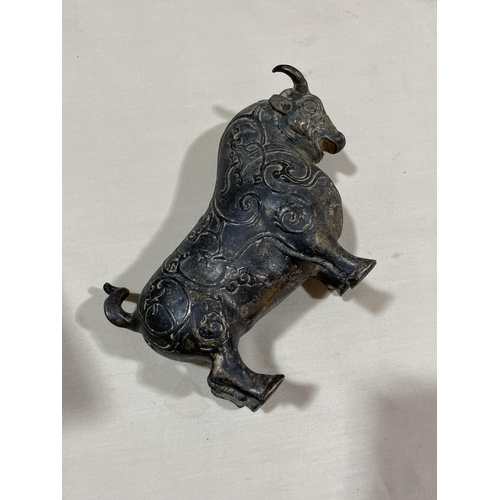 234 - A gilt patinated bronze bull, with relief moulded surface decoration, length 18cm