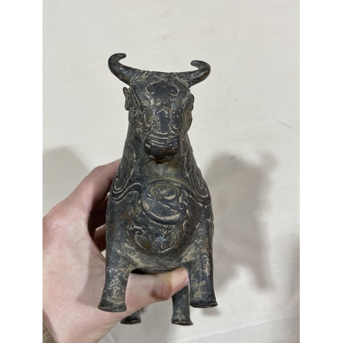 234 - A gilt patinated bronze bull, with relief moulded surface decoration, length 18cm