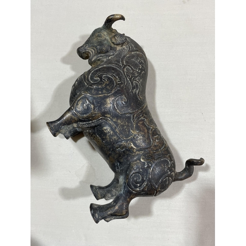 234 - A gilt patinated bronze bull, with relief moulded surface decoration, length 18cm