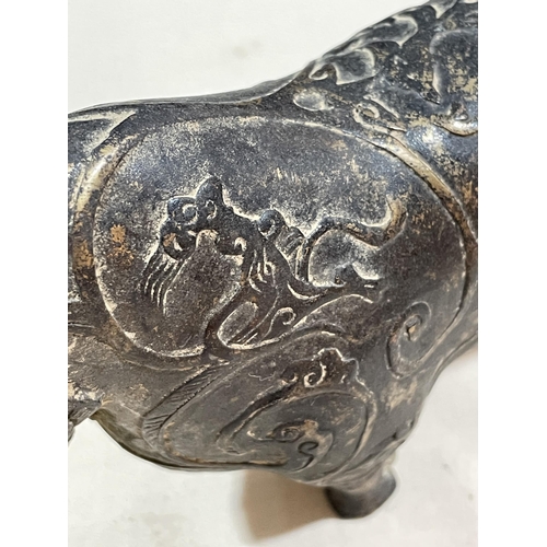 234 - A gilt patinated bronze bull, with relief moulded surface decoration, length 18cm