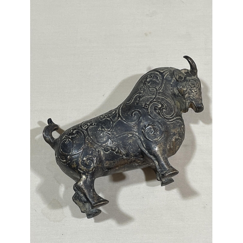 234 - A gilt patinated bronze bull, with relief moulded surface decoration, length 18cm