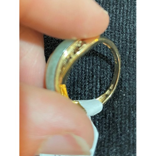 743 - A modern 9ct gold jade dress ring, with pierced Greek key shoulders, setting height 7.8mm, size M, 2... 