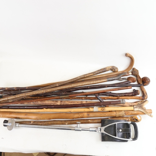 104 - A quantity of Vintage walking and trekking sticks, a shooting stick, and silver-topped cane