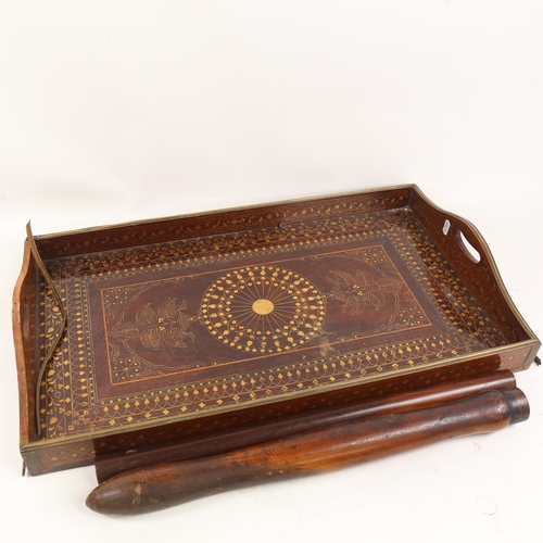 61 - An Indian brass inlaid hardwood tea tray, a lignum vitae tipstaff etc (3)