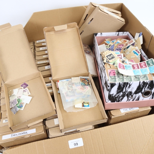 99 - A large quantity of Vintage world loose postage stamps (boxful)