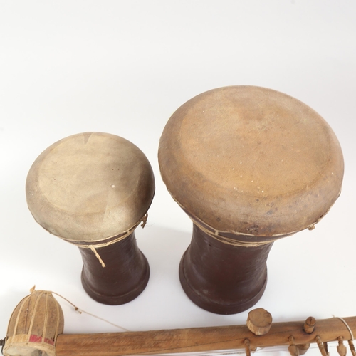 202 - Various Tribal instruments, including drums (3)