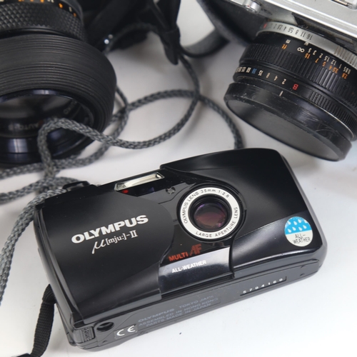 209 - OLYMPUS - a Vintage OM10 35mm single lens reflex camera, with Olympus 50mm 1:1.4 lens and skylite 49... 