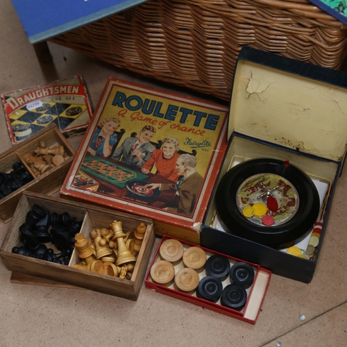 291 - Wicker basket, containing 2 boxwood and ebonised chess sets, Vintage games etc