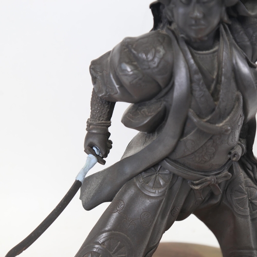 303 - An Art Deco style silvered resin Japanese Samurai sculpture, on stepped resin base, overall height 4... 