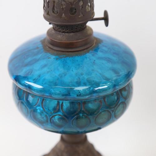 333 - An Antique glass oil lamp on pierced cast-iron plinth, 45cm, and another