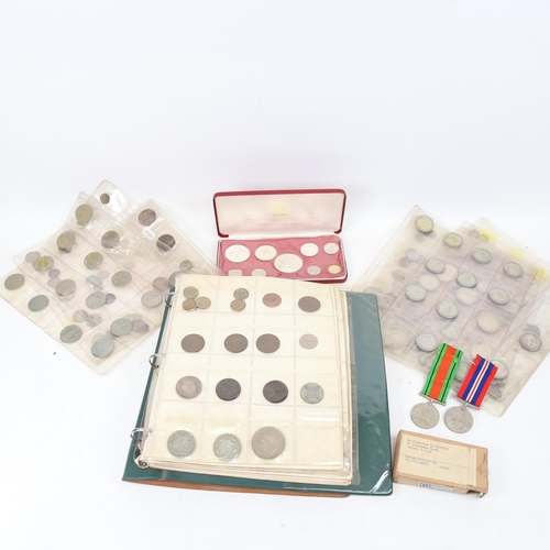 337 - A coin album containing Victorian silver half crowns, and other silver coins, various sleeves of coi... 