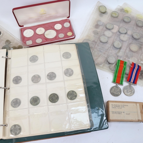 337 - A coin album containing Victorian silver half crowns, and other silver coins, various sleeves of coi... 