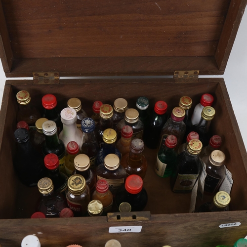 340 - A box containing miniature liqueurs, Whiskys etc