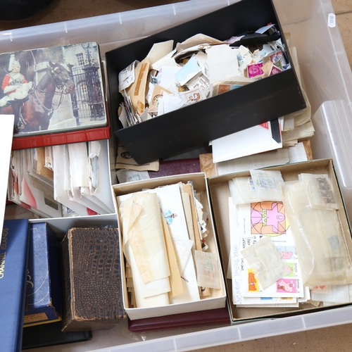 386 - A large boxful of postage stamps, including Jersey First Day Covers, Mint, and loose stamps