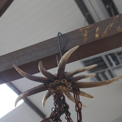 393 - A Vintage ceiling light fitting made from stag's antlers, 69cm across