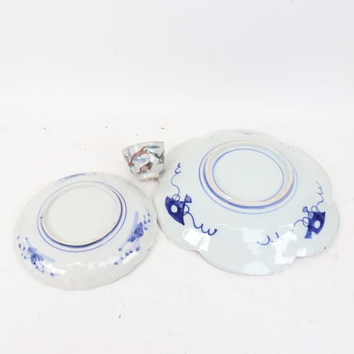 426 - A Chinese porcelain tea bowl, with painted dragon and animals, and 2 Imari plates