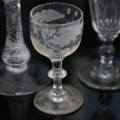 465 - An Antique glass goblet with etched border and air twist stem, 17.5cm, and 4 other Antique glasses