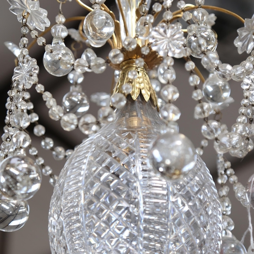 480 - A gilt-metal chandelier, with swags of lustre drops and cut-glass light bowl, 26cm across