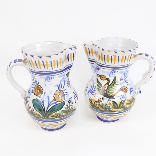 501 - A pair of Continental Agua jugs, 25cm