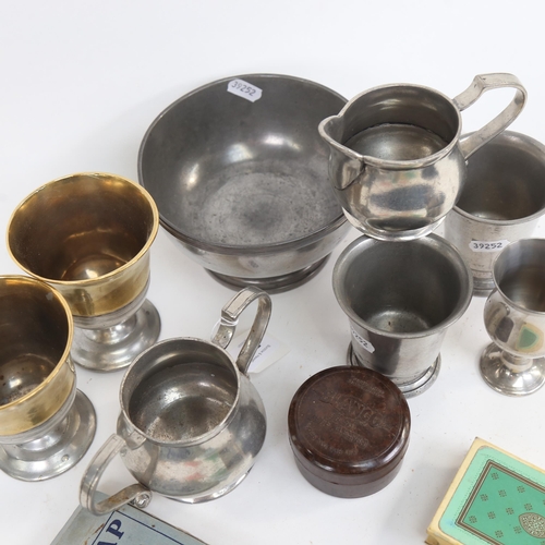 506 - Pewter beakers, gilded pewter goblets with touch marks, playing cards etc