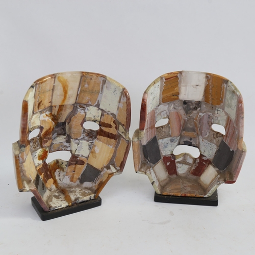 536 - A pair of Mexican hardstone mask sculptures, height 22cm (1 repaired)