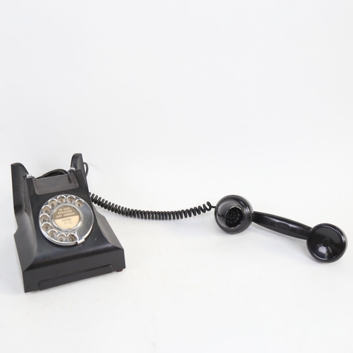 548 - A Vintage black Bakelite dial telephone