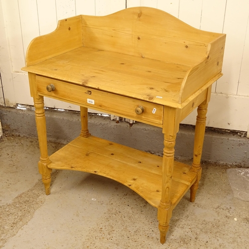 2516 - A pine washstand, with raised back and single drawer, W86cm, H102cm, D43cm