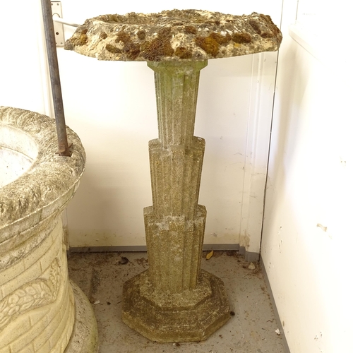 2701 - A weathered concrete birdbath, on an Art Deco style column support with plinth base, W65cm, H107cm