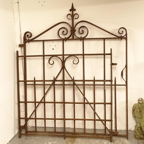 2713 - A scrolled wrought-iron side gate, width including hinge mount 115cm, H141cm, and a small wrought-ir... 