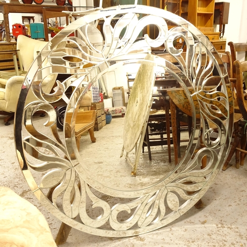 2738 - A circular bevel-edge wall mirror, W118cm