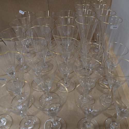 575 - A suite of gold-rimmed glasses with cut-glass stems